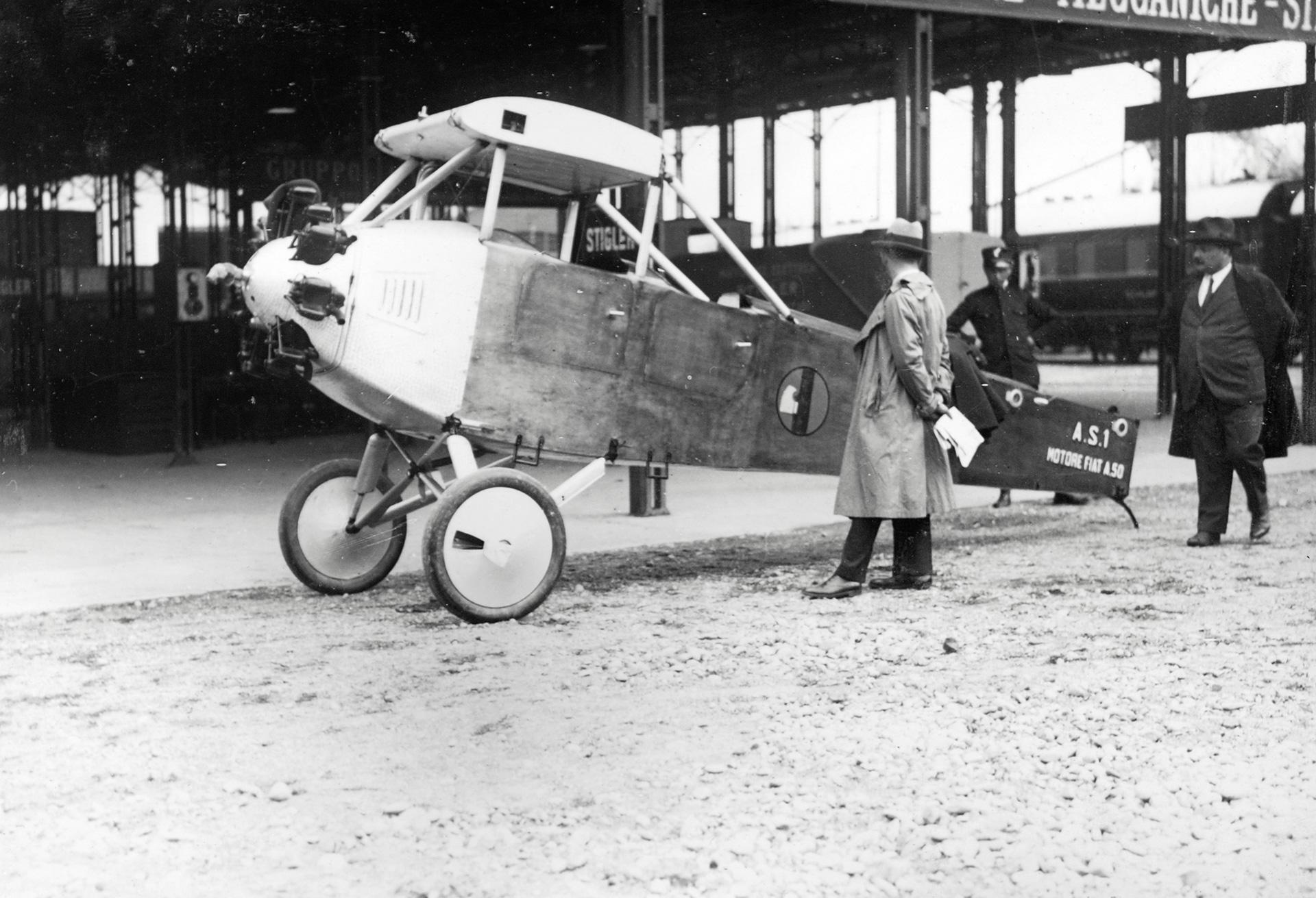 Airplane being set up in the aeronautics pavillon at the 1929 Milan Trade Fair